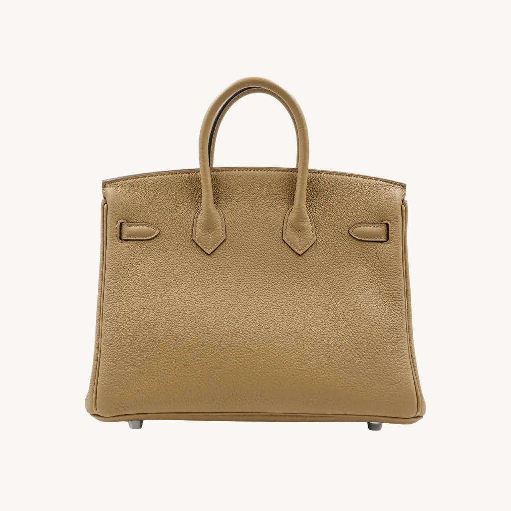 Tan leather handbag on a white background