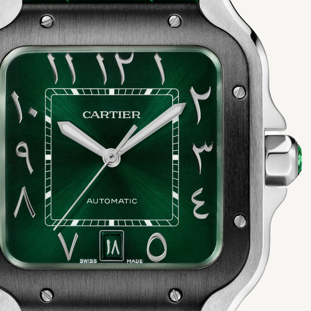 Cartier watch with green face and silver case on a white background